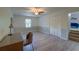 A well-lit bedroom features a ceiling fan, a large closet, and a desk for a flexible living space at 202 Hunt Club Dr, Summerville, SC 29485