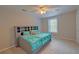 A bright bedroom features a window, a cozy bed, and a headboard with integrated storage shelves at 202 Hunt Club Dr, Summerville, SC 29485