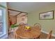Dining area with a round wooden table and chairs, open to the living space at 202 Hunt Club Dr, Summerville, SC 29485