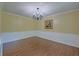 Formal dining room featuring wainscoting, chandelier, and wood floors at 202 Hunt Club Dr, Summerville, SC 29485