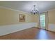 Bright dining room features a modern chandelier, and is ready for your personal touches at 202 Hunt Club Dr, Summerville, SC 29485
