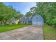 Charming home with a well-manicured lawn, mature trees, and a spacious driveway at 202 Hunt Club Dr, Summerville, SC 29485