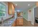 Kitchen with wood cabinets, granite countertops, and stainless steel sink at 202 Hunt Club Dr, Summerville, SC 29485