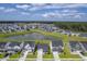 Scenic aerial view of a community with a central pond, highlighting its peaceful and spacious environment at 206 Camellia Bloom Dr, Moncks Corner, SC 29461