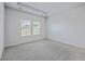 Bedroom features neutral carpet, two windows and a recessed ceiling at 206 Camellia Bloom Dr, Moncks Corner, SC 29461