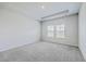 Light and bright bedroom features neutral carpet, two windows and a recessed ceiling at 206 Camellia Bloom Dr, Moncks Corner, SC 29461