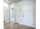 Bright entryway featuring wood floors, and multiple doorways at 206 Camellia Bloom Dr, Moncks Corner, SC 29461