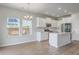 Modern kitchen with white cabinets, stainless steel appliances, and a stylish lighting fixture at 206 Camellia Bloom Dr, Moncks Corner, SC 29461