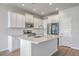 Kitchen with white cabinets, stainless steel appliances, and quartz countertops at 206 Camellia Bloom Dr, Moncks Corner, SC 29461