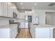 Kitchen featuring white cabinets, quartz countertops, and stainless steel appliances at 206 Camellia Bloom Dr, Moncks Corner, SC 29461