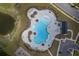 Overhead shot of a modern, resort-style community pool, playground, and clubhouse at 206 Camellia Bloom Dr, Moncks Corner, SC 29461