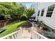 Grassy backyard featuring lush landscaping and stone paver patio at 2152 Pentland Dr, Charleston, SC 29412