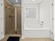 This bathroom features a soaking tub, a separate shower, and a window at 2152 Pentland Dr, Charleston, SC 29412