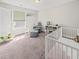 Bright Bedroom with neutral walls, comfortable seating, and a cute crib with stuffed animals at 2152 Pentland Dr, Charleston, SC 29412