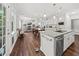 Open kitchen and living room with a breakfast bar, stainless steel appliances, and hardwood floors at 2152 Pentland Dr, Charleston, SC 29412
