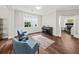 Open floorplan with hard wood floors, white trim, and windows with natural light at 2152 Pentland Dr, Charleston, SC 29412