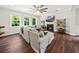 Cozy living room featuring a fireplace, hardwood floors, and large windows for natural light at 2152 Pentland Dr, Charleston, SC 29412