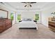 Spacious main bedroom with large windows, tray ceiling, and lots of natural light at 2152 Pentland Dr, Charleston, SC 29412