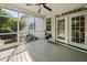 Inviting screened porch with ceiling fan and access to backyard at 2152 Pentland Dr, Charleston, SC 29412