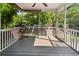 Spacious screened porch with gray flooring, and view of playground at 2152 Pentland Dr, Charleston, SC 29412