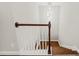 An interior view of the staircase with wooden handrail and a modern chandelier at 2152 Pentland Dr, Charleston, SC 29412