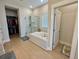 Bright bathroom with a soaking tub and glass-enclosed shower at 2221 Generals St, Charleston, SC 29492