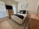 Cozy bedroom with a plush bed, natural light, and neutral walls at 2221 Generals St, Charleston, SC 29492