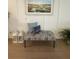 Bench with patterned upholstery and throw pillows, next to wall art at 2221 Generals St, Charleston, SC 29492