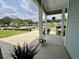 Wide front porch overlooking a tranquil street and landscaping at 2221 Generals St, Charleston, SC 29492
