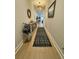 Bright hallway with wood floors, stylish runner, and decorative accents at 2221 Generals St, Charleston, SC 29492