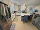 Modern kitchen featuring white cabinets, stainless steel appliances, a large center island, and hardwood floors at 2221 Generals St, Charleston, SC 29492