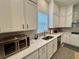 Well-lit kitchen featuring sleek countertops, stainless steel appliances, and modern cabinetry at 2221 Generals St, Charleston, SC 29492