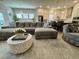 Comfortable living room featuring plush seating, stylish rug, and open concept design to the kitchen at 2221 Generals St, Charleston, SC 29492