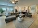 Expansive living area showcasing a comfortable sectional, open floor plan, and abundant natural light at 2221 Generals St, Charleston, SC 29492