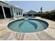 Beautiful backyard pool area with built-in jacuzzi and surrounding landscaping, perfect for outdoor enjoyment at 2221 Generals St, Charleston, SC 29492