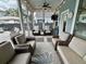 Inviting screened porch with comfortable seating and ceiling fan for relaxing outdoor living at 2221 Generals St, Charleston, SC 29492