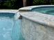 Pool's spa close up, featuring a stone surround and a gentle waterfall detail at 2221 Generals St, Charleston, SC 29492