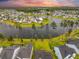 Lakeside homes nestled within a serene community, showcasing lush landscapes and peaceful waters at 223 Granton Edge Ln, Summerville, SC 29486