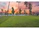 Beautiful backyard view with lush green grass, a pond, and trees, creating a serene and picturesque outdoor space at 223 Granton Edge Ln, Summerville, SC 29486