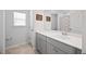 Bright bathroom with a wide mirror, single sink, and colorful shower curtain at 223 Granton Edge Ln, Summerville, SC 29486