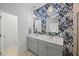 Elegant bathroom featuring double sinks with designer wallpaper and modern fixtures at 223 Granton Edge Ln, Summerville, SC 29486