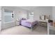 Cozy bedroom features a metal frame bed, light gray walls, carpet floors and windows to provide lots of natural light at 223 Granton Edge Ln, Summerville, SC 29486