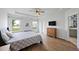 Main bedroom featuring tray ceiling, water view, and en-suite bathroom at 223 Granton Edge Ln, Summerville, SC 29486