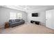 Bright bonus room with neutral carpet, a ceiling fan, and a comfortable sofa at 223 Granton Edge Ln, Summerville, SC 29486