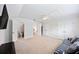 Upstairs bonus room area has neutral carpet, storage closets, and a ceiling fan at 223 Granton Edge Ln, Summerville, SC 29486