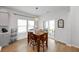 Charming breakfast nook with wood table, wicker pendant light, and sliding glass door at 223 Granton Edge Ln, Summerville, SC 29486