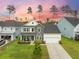 Charming two-story home with stone accents, a well-manicured lawn, and a welcoming front porch at 223 Granton Edge Ln, Summerville, SC 29486