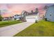 Beautiful home with a long driveway, well-kept lawn, and appealing architectural design in a friendly neighborhood at 223 Granton Edge Ln, Summerville, SC 29486