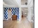 Bright foyer with high ceilings, an accent wall, and an open view into the dining and living spaces at 223 Granton Edge Ln, Summerville, SC 29486