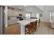 Modern kitchen featuring a center island with seating, stainless steel appliances, and sleek gray cabinetry at 223 Granton Edge Ln, Summerville, SC 29486